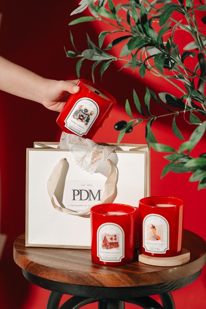 PDM Christmas Collection candles in red jars with a Pabango de Manila gift bag